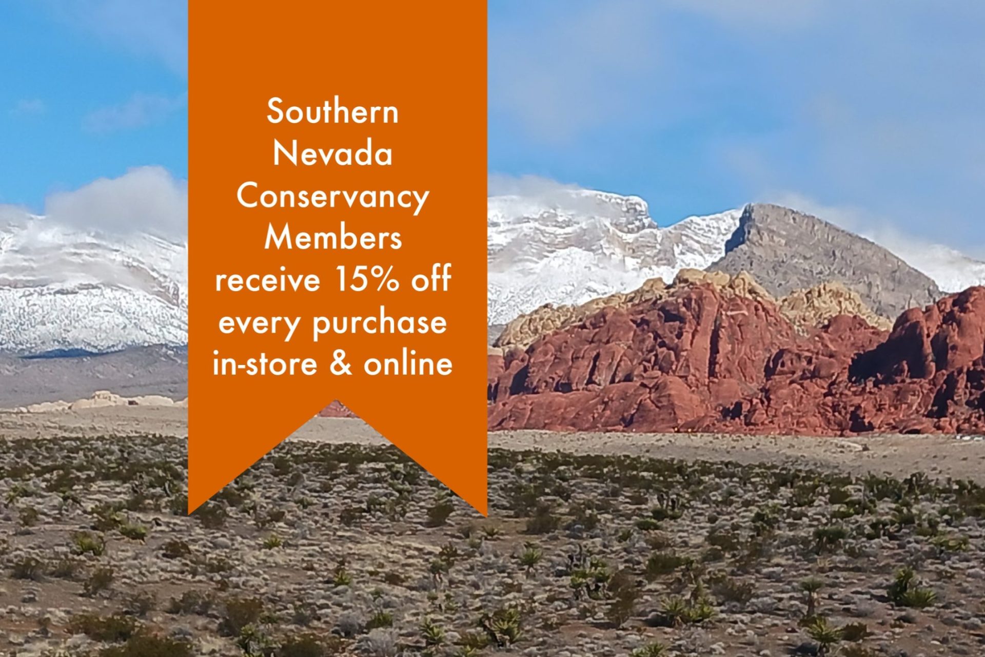 Southern Nevada Conservancy members receive a 15 percent discount on purchases in store and online wording over bright red rock hills and brown scrub desert
